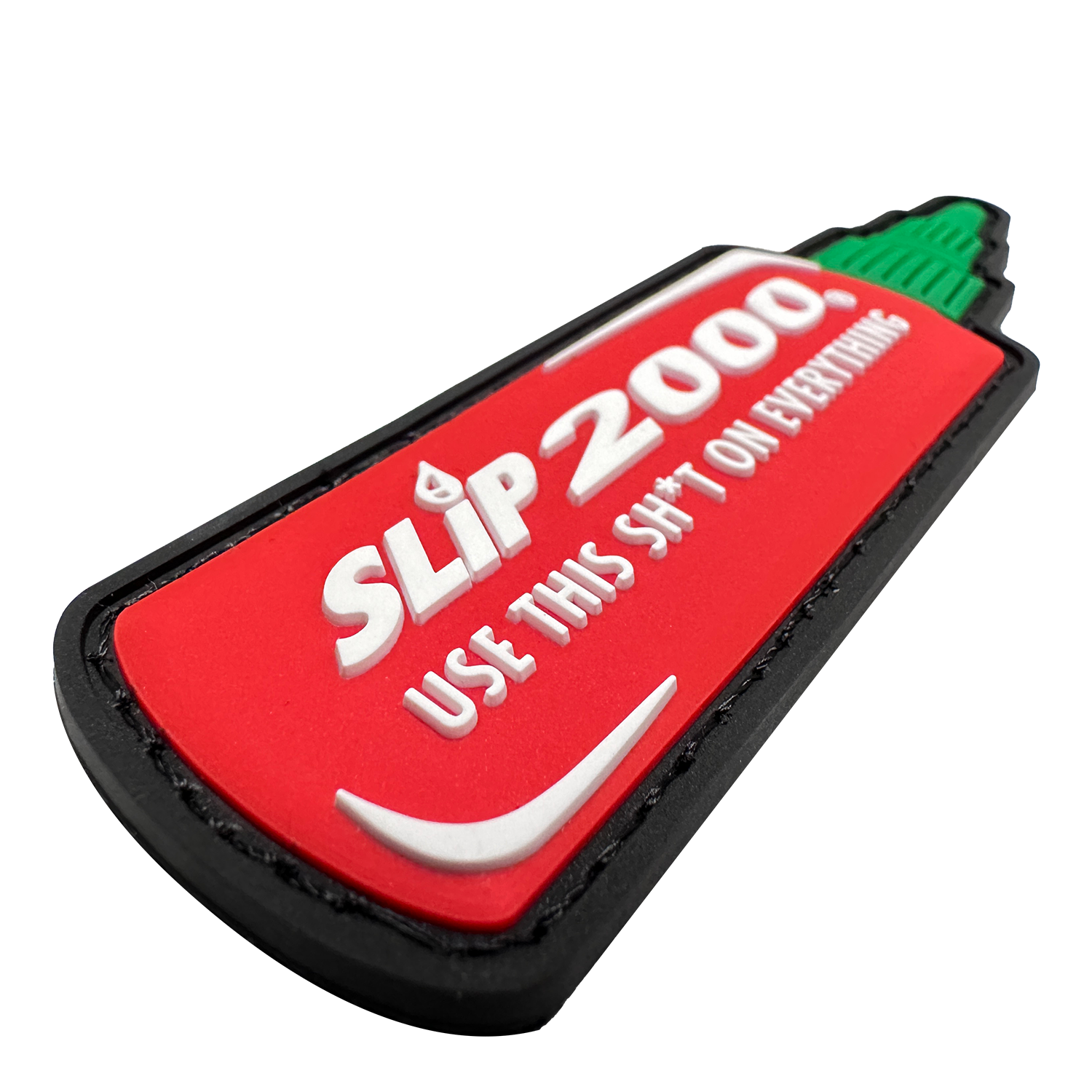 A closeup showing the texture and detail of the Slip 2000 Hot Sauce Patch. Has the Slip 2000 Logo and "use this sh*t on everything" in white on a red background with the cap part of the design in green
